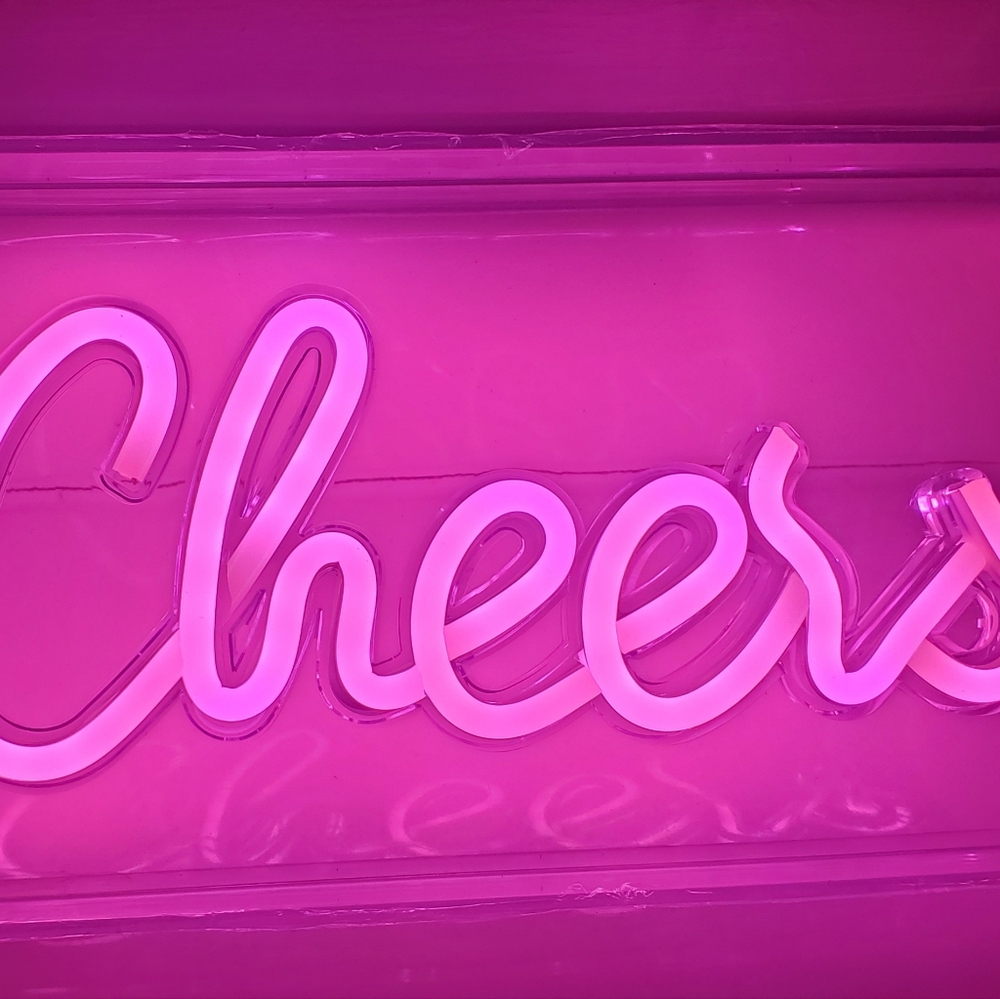 Pink cheers neon sign
